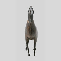 wooden and iron dog figurine, detail view