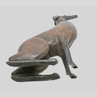 wooden and iron dog figurine, rear view