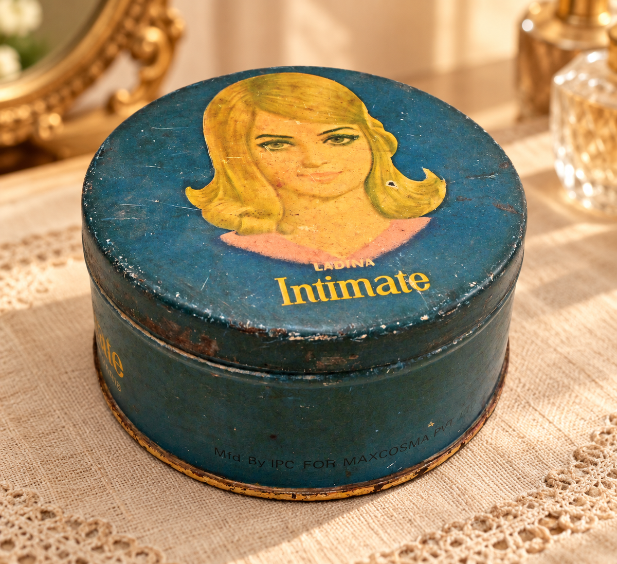 Vintage blue Ladina Intimate Luxury Talc tin with retro portrait, front view