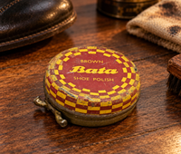 Vintage brown Bata shoe polish printed iron box, front view