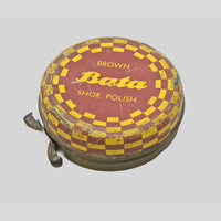 Vintage brown Bata shoe polish printed iron box, angled view