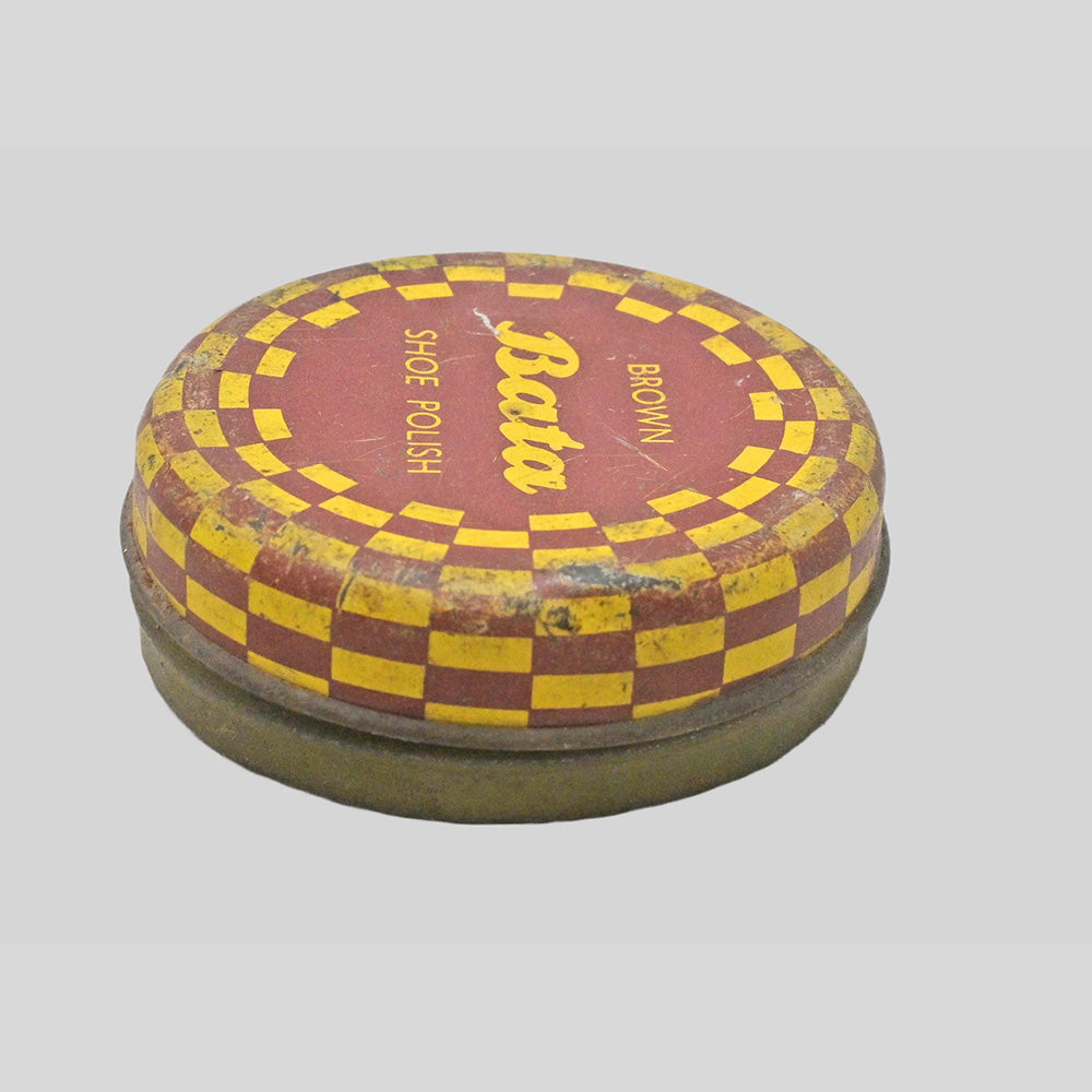 Vintage brown Bata shoe polish printed iron box, close-up detail