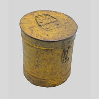Vintage handcrafted iron storage canister with lid and latch, angled view