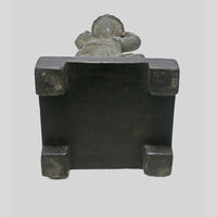 Antique cast metal man figurine carrying a pot, decorative candle holder, additional view