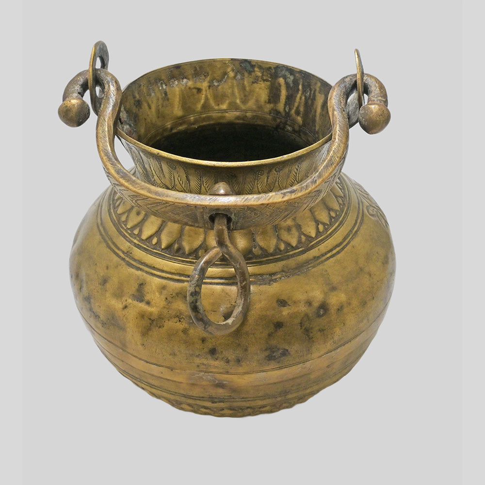 Antique brass holy water pot with engraved floral and traditional figures, alternate view