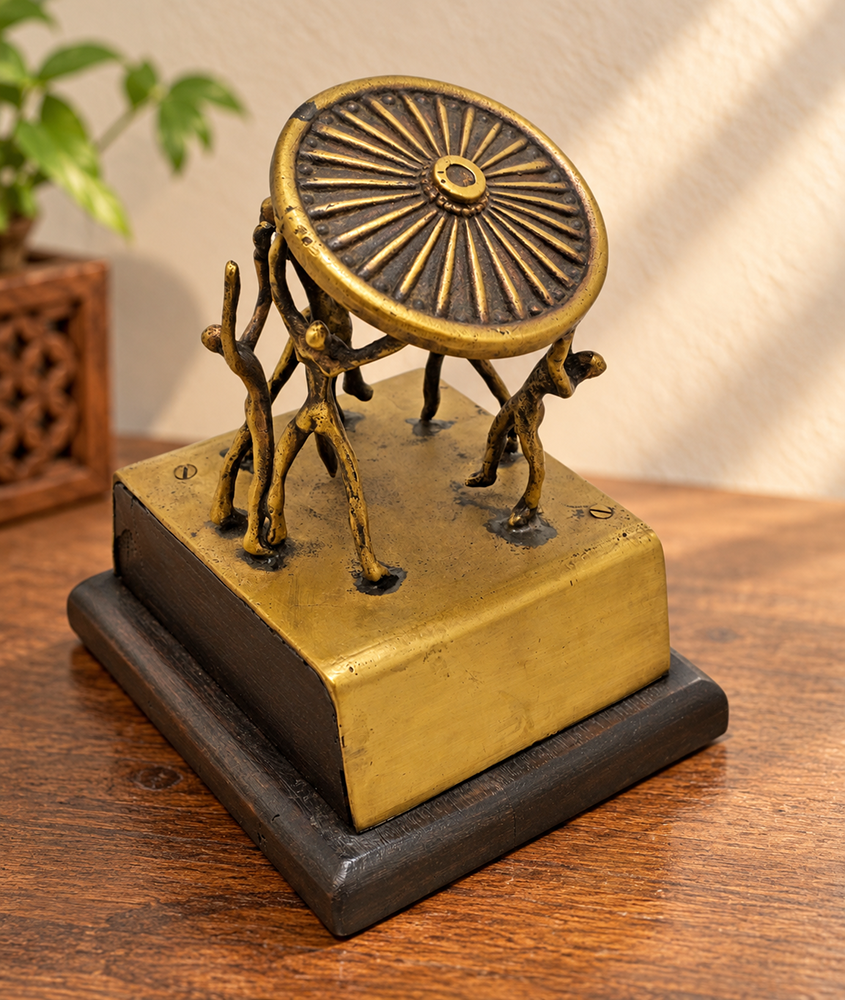 Vintage handcrafted brass figurine with fine artwork detailing, front view