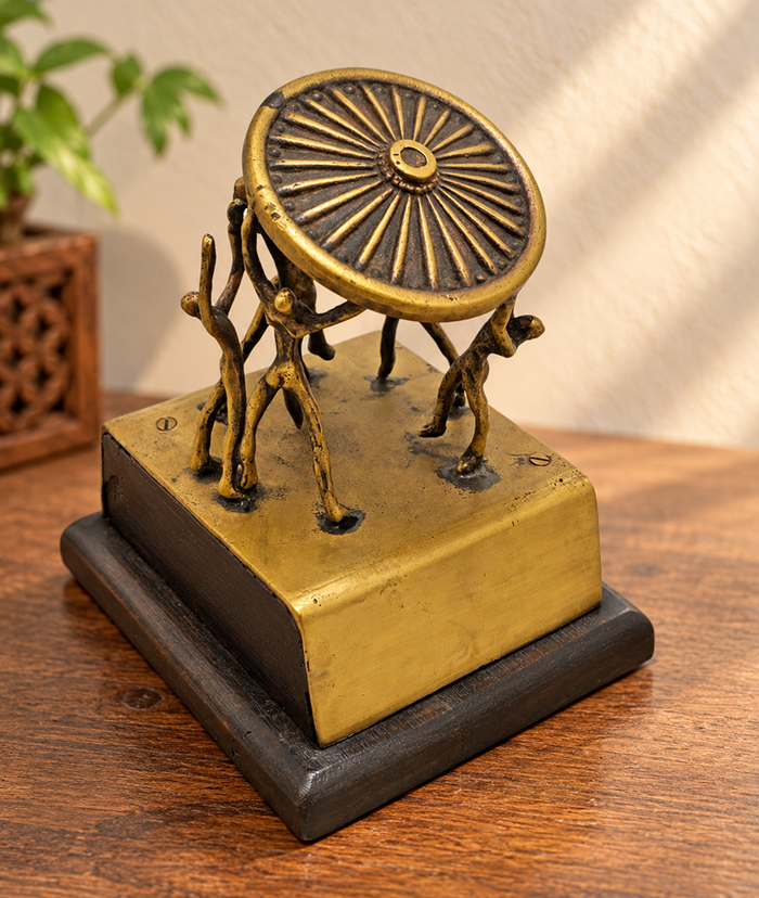 Vintage handcrafted brass figurine with fine artwork detailing, front view