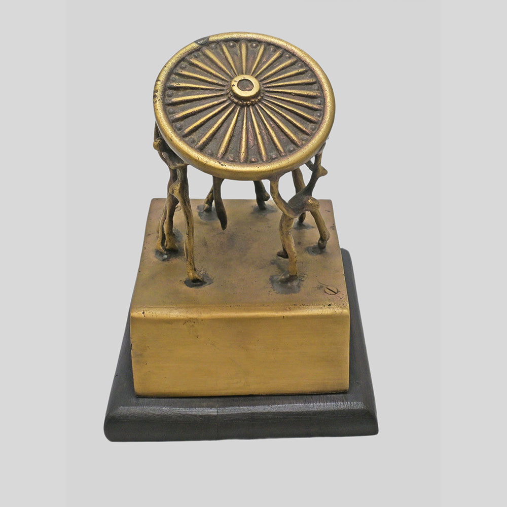 Vintage handcrafted brass figurine with fine artwork detailing, close-up detail