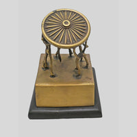 Vintage handcrafted brass figurine with fine artwork detailing, close-up detail