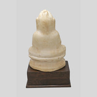 Hand-carved seated Jain Lord Mahavira statue on wooden display base, alternate view