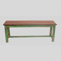 Handcrafted rustic colonial wooden bench with distressed green finish, close-up detail