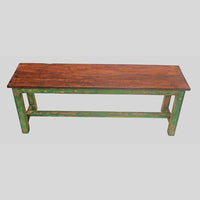Handcrafted rustic colonial wooden bench with distressed green finish, side view