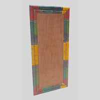 Recycled handcrafted wooden rectangular frame made from lacquer-painted old pillars, angled view