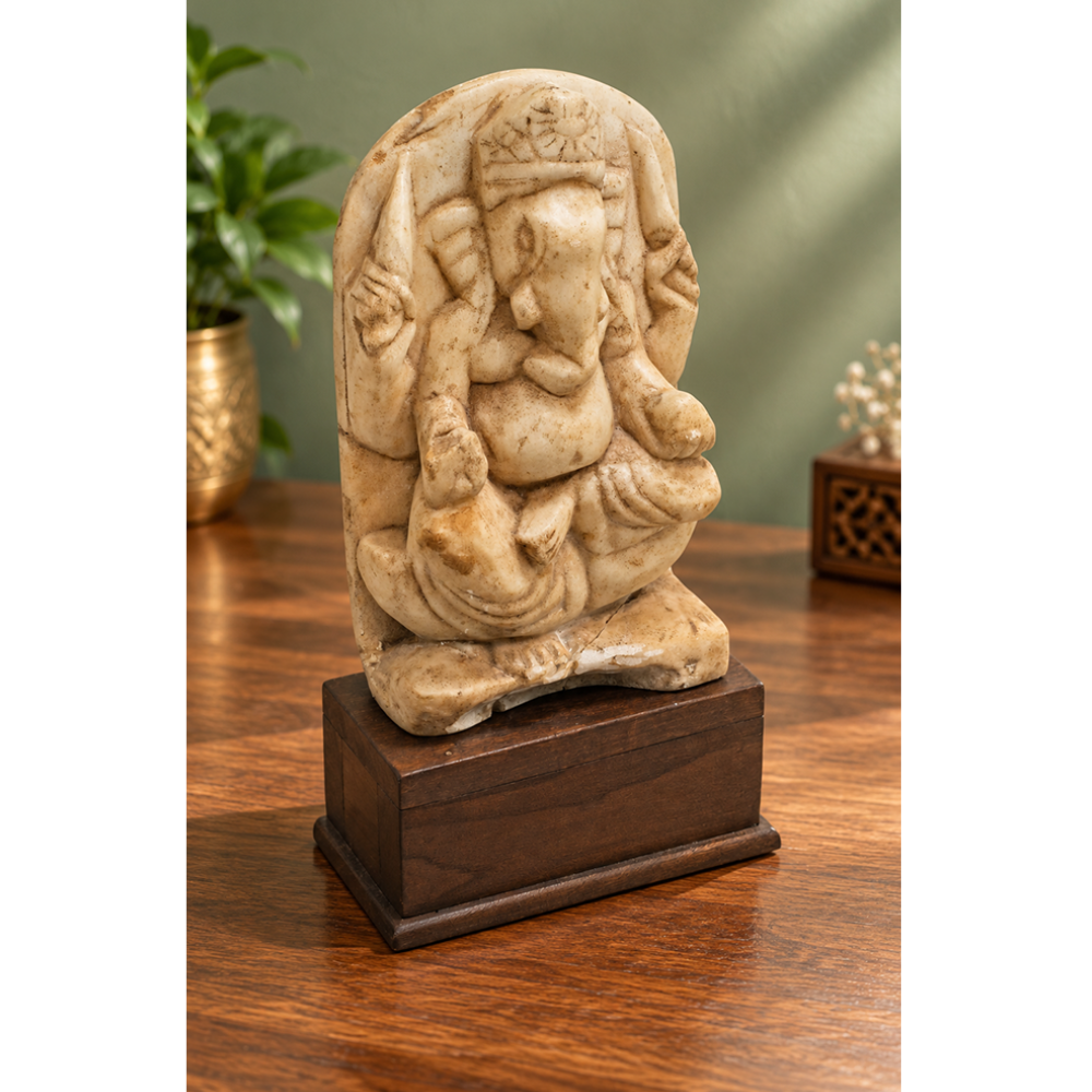 Vintage marble Hindu Lord Ganesha statue on wooden base, front view