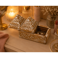 Handcrafted tribal wooden jewelry box with pyramid lid and carved details, front view