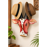 Hand-painted wooden cow head wall hat holder, front view