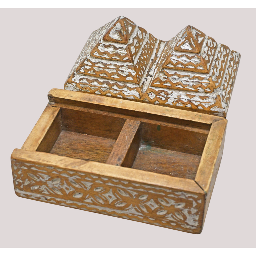 Handcrafted tribal wooden jewelry box with pyramid lid and carved details, side view