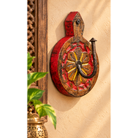 Red-sided carved wooden wall key holder with floral motif, front view