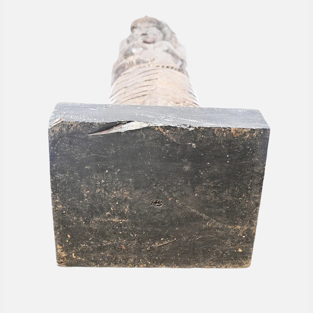 Antique wooden figurine showing its handcrafted details