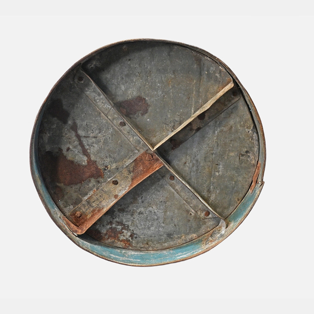 Detail of traditional metal measuring pot