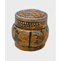 Close-up of hand-painted artwork on papier-mâché box