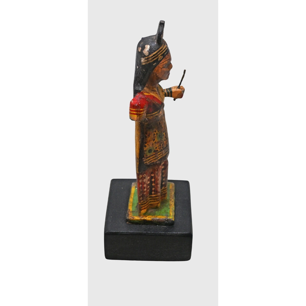 Side view of antique-style wooden Radha Ji statue
