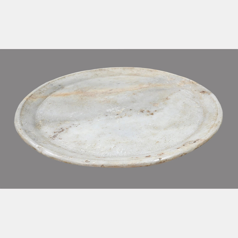 White marble food serving plate showing its shape