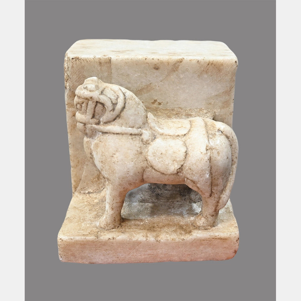 Close-up of carved marble horse figure bookend