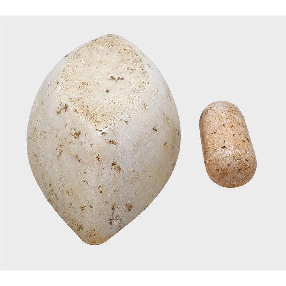 White marble mortar and pestle showing its profile