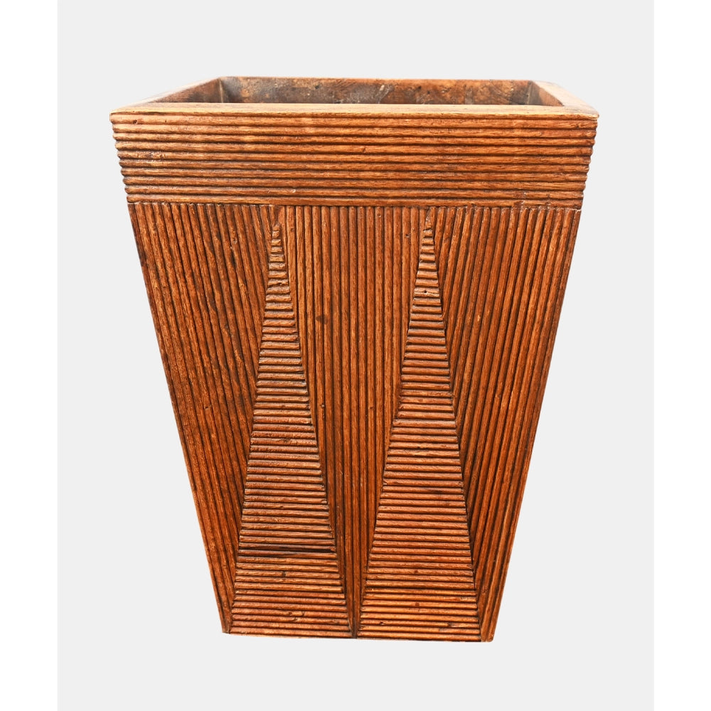 Carved linear pattern on natural brown wooden planter