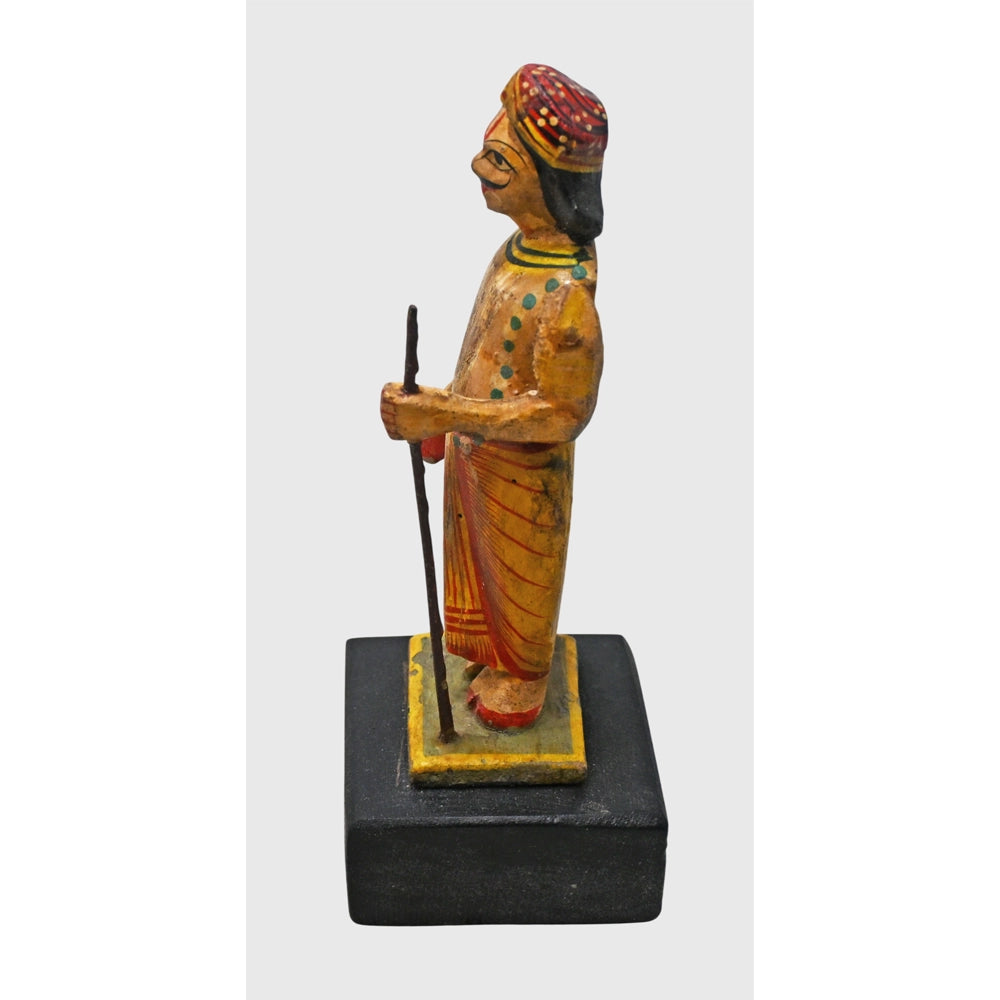 Close-up of painted details on Indian watchman figurine