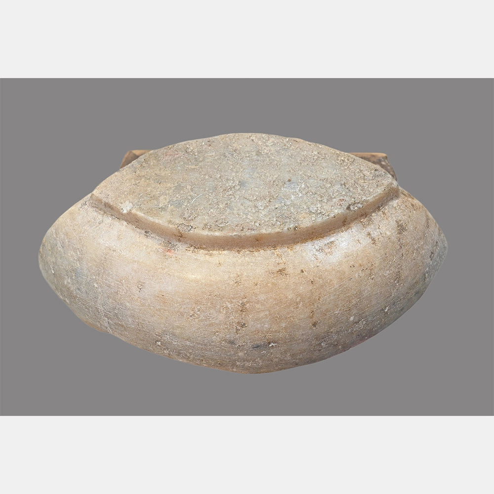 Angled view of handcrafted natural white marble bowl