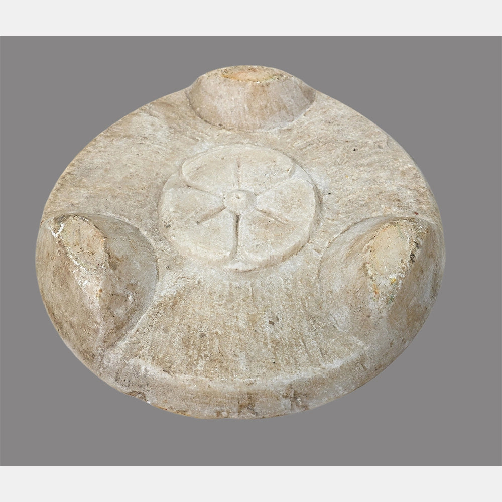 Angled view of white marble chapati serving plate