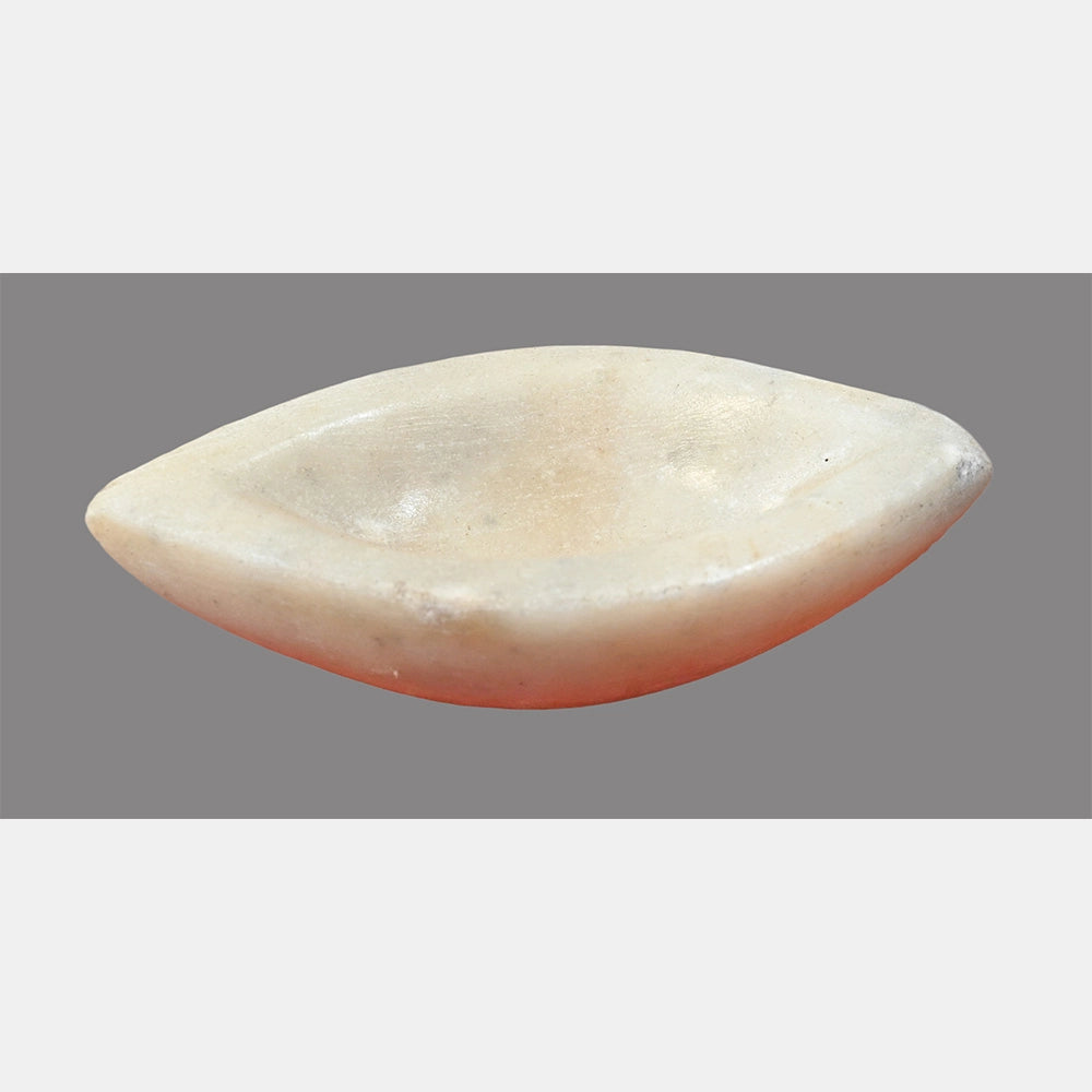 White marble grinding bowl showing curved boat profile