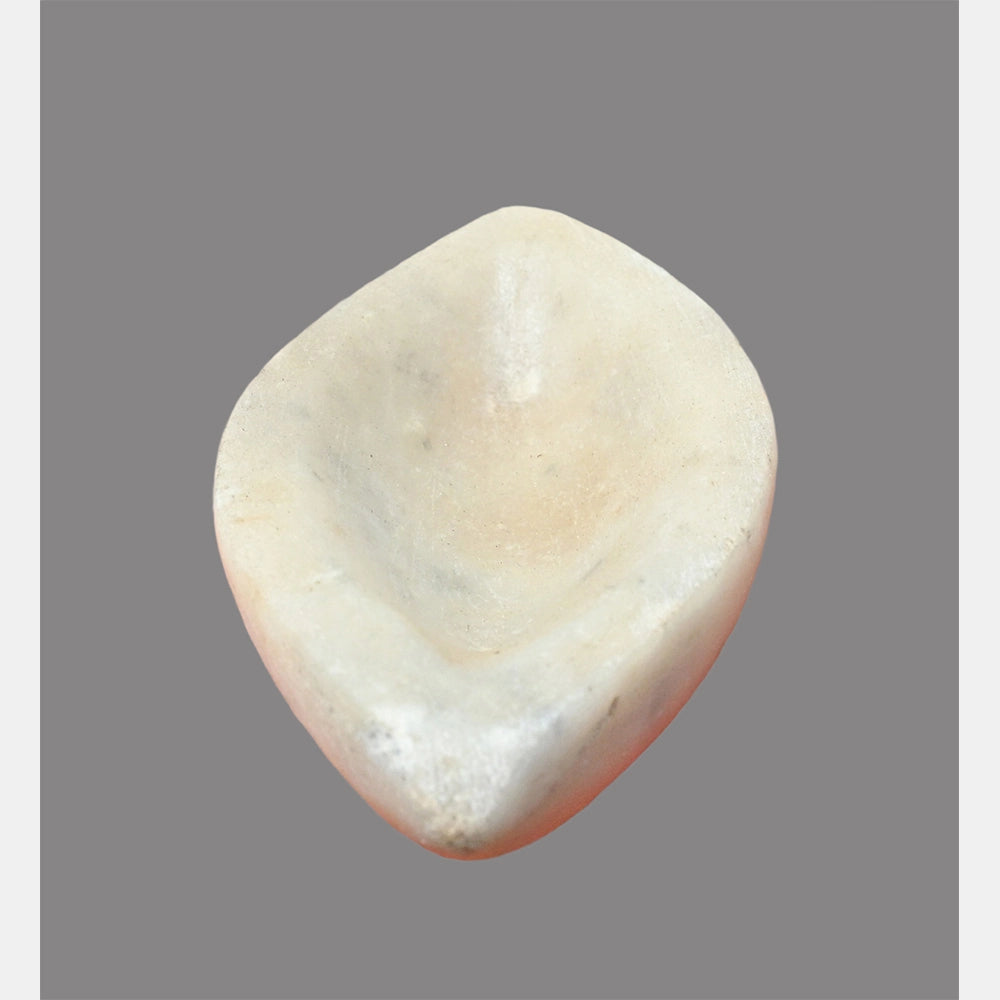 Close-up of handcrafted boat-shaped marble bowl
