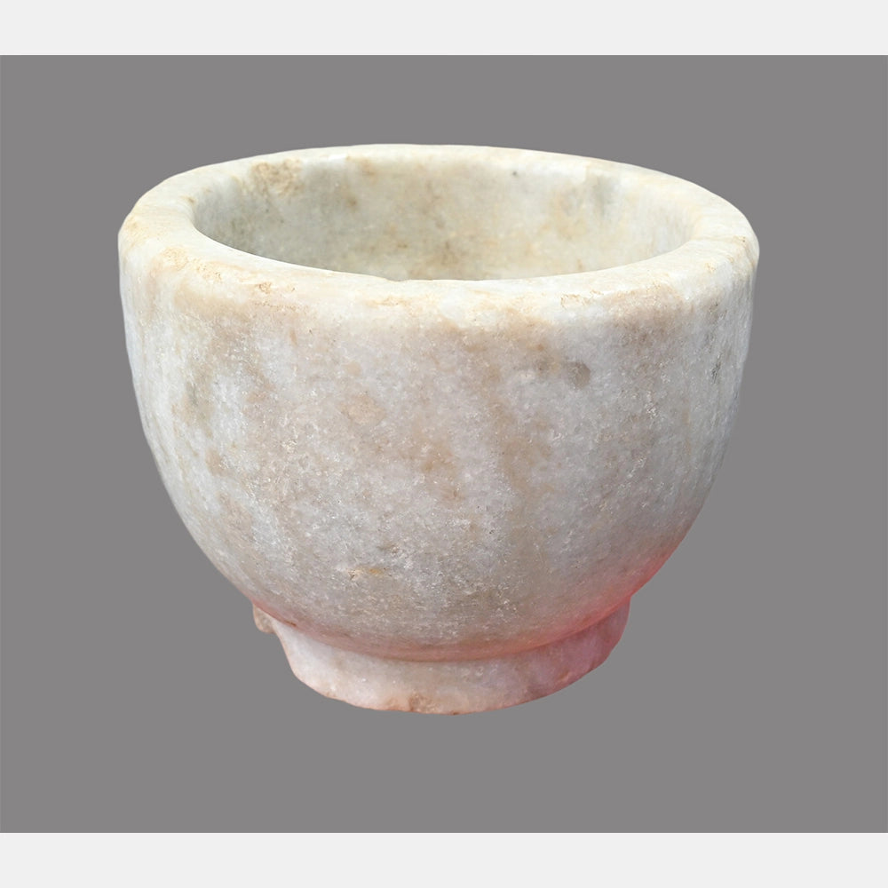Round marble grinding bowl showing natural stone finish