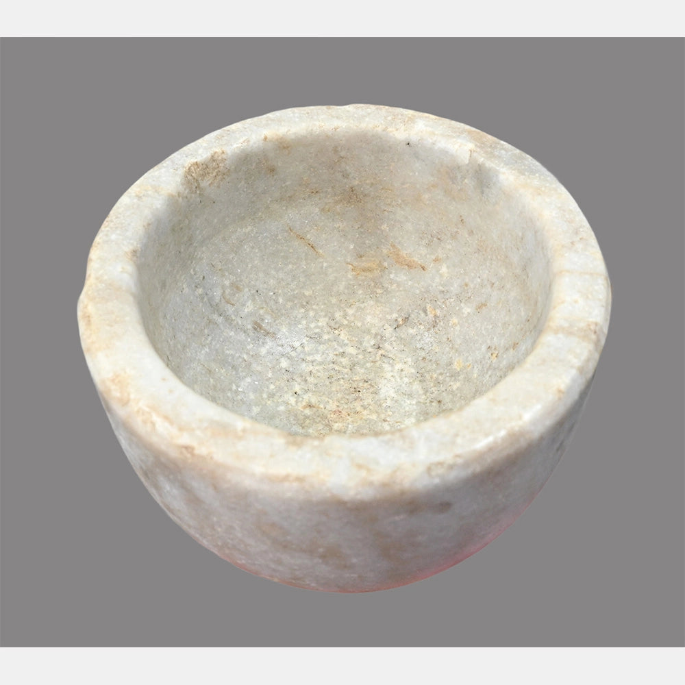 Close-up of handcrafted marble grinding bowl
