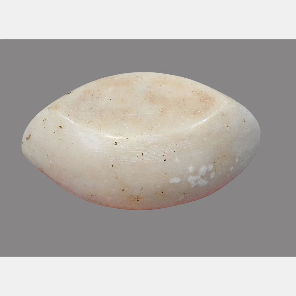 Angled view of white marble Karal grinding bowl