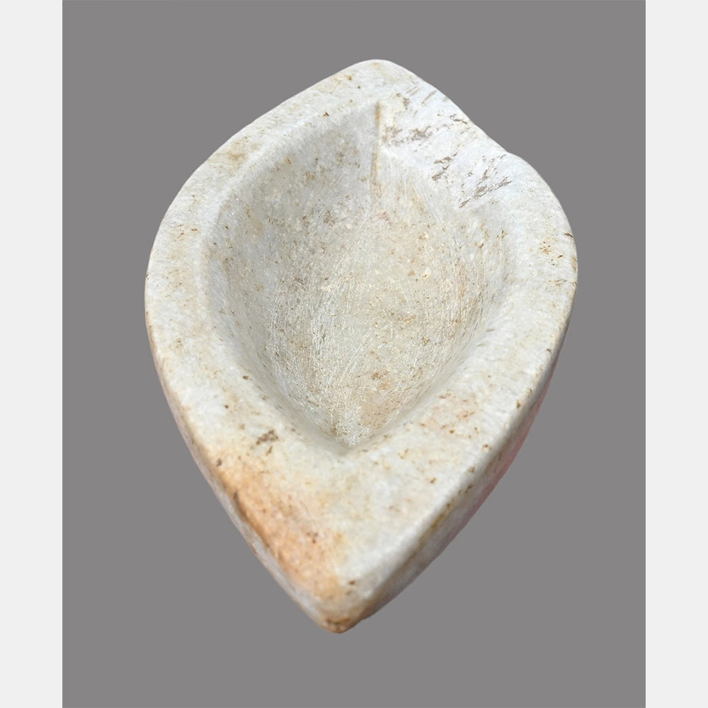 Close-up of handcrafted white marble spice bowl