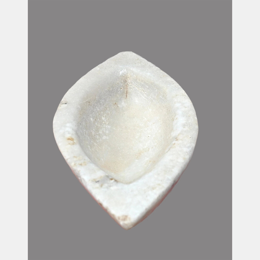 Close-up of rustic white marble mortar bowl