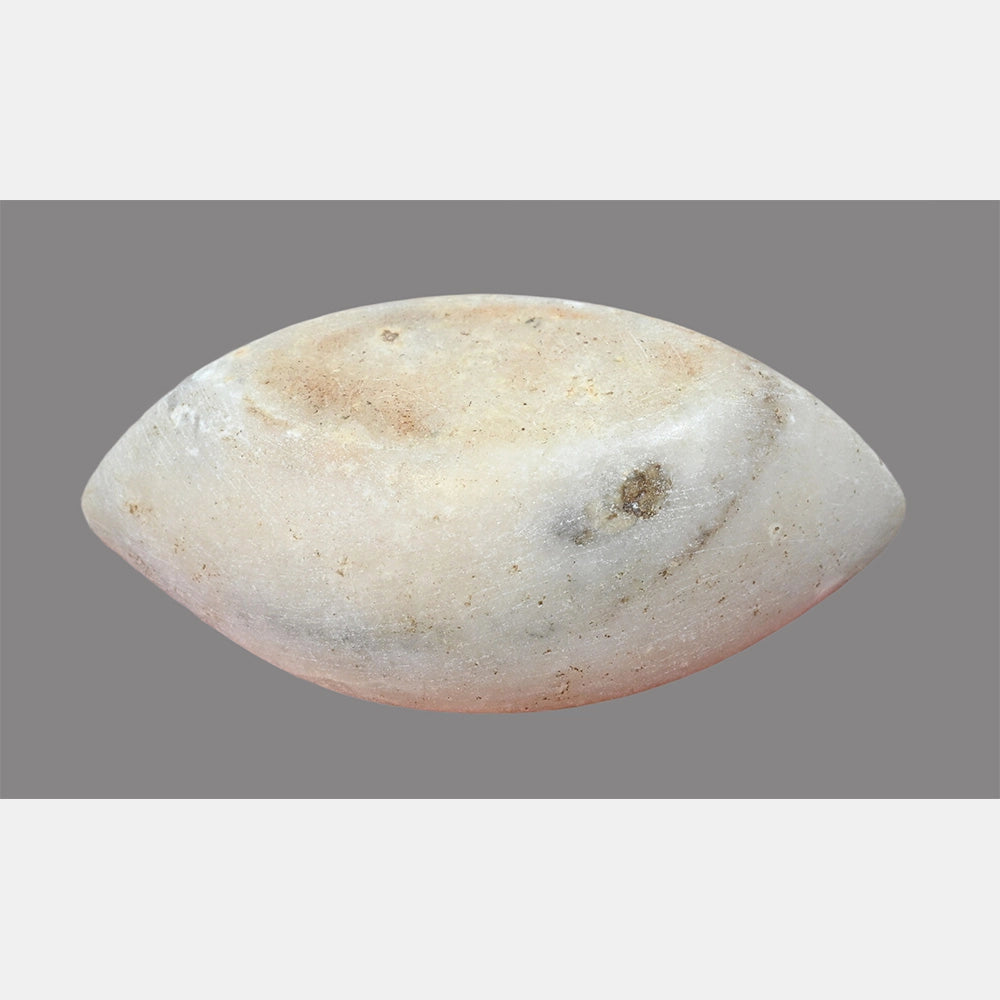 Angled view of shallow white marble mortar bowl