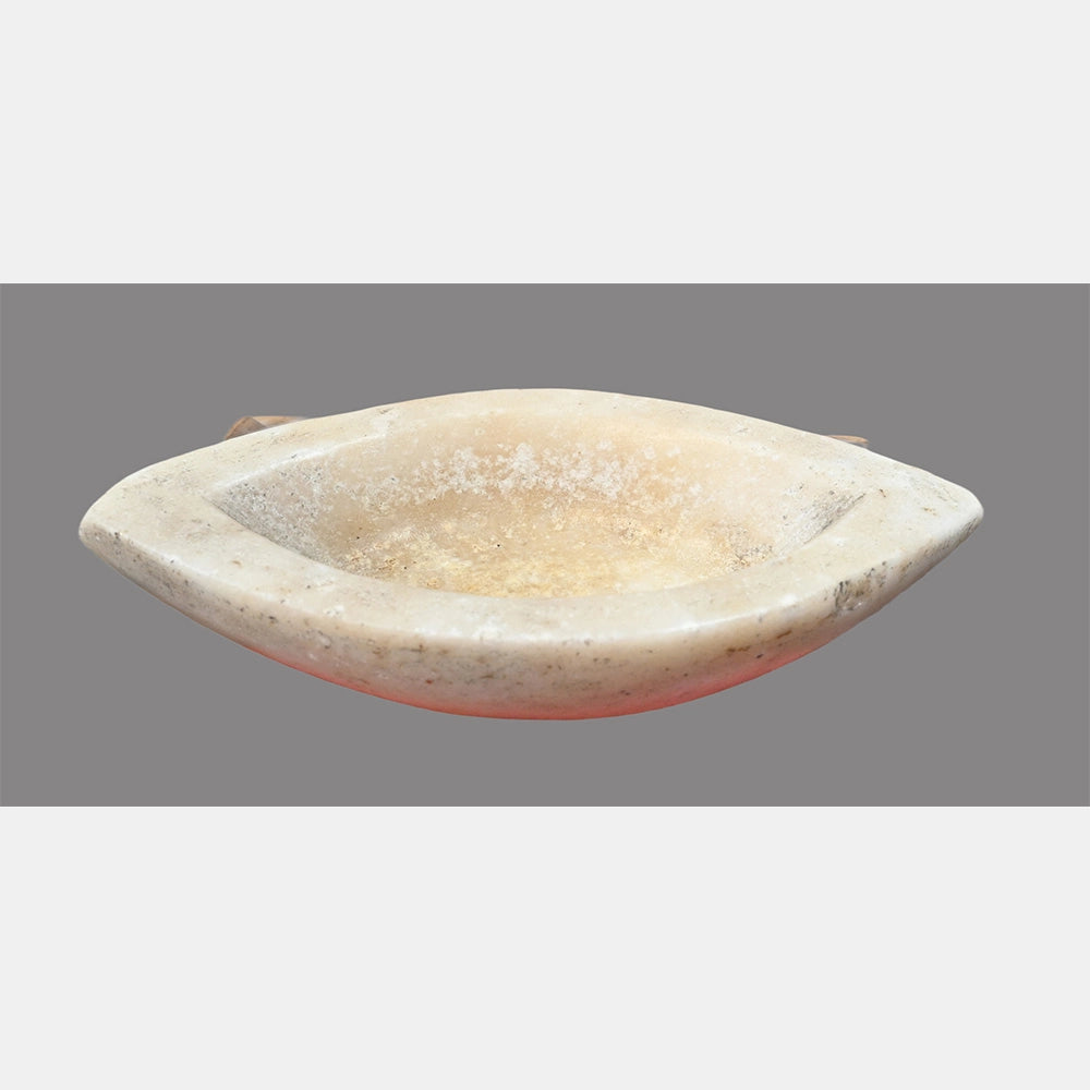 Close-up of shallow handcrafted marble mortar bowl